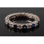 A white metal, sapphire and diamond full hoop eternity ring by Tiffany & Co, comprising 13 round