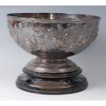 An Edwardian silver footed rose bowl, the whole chased with flowers and foliage, 29oz, maker