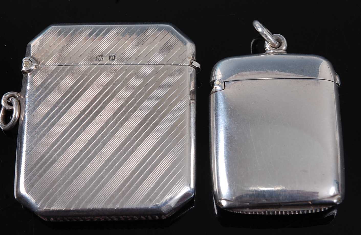 A George V silver vesta, of canted rectangular form, having line engraved decoration, maker Deakin &
