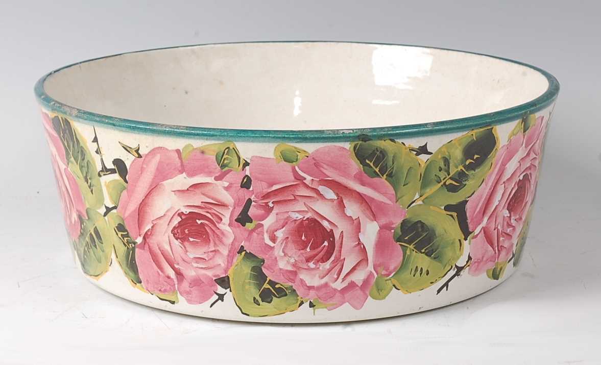 A 19th century Wemyss ware bowl, polychrome decorated with cabbage-roses, signed verso Wemyss T