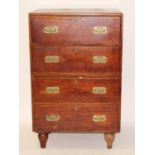 A teak campaign chest, in two sections, each with two drawers and having flush brass handles, all