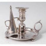 A Queen Anne silver chamberstick, of circular form with loop handle, the pedestal baluster and