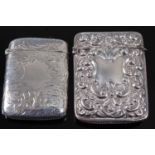 A late Victorian silver vesta, of hinged rectangular form, having floral engraved decoration and