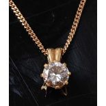 A yellow metal diamond single stone pendant, comprising a round brilliant cut diamond in an eight-