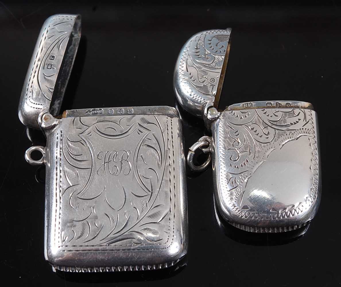 A George V silver vesta, of hinged rectangular form, having all-over foliate engraved decoration and - Image 2 of 2