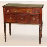 A George III mahogany games table, having a gilt tooled leather inset top above an arrangement of