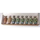 A cased set of eight Japanese cloisonné enamel vases, 20th century, each showing a different process