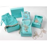 A selection of four pieces of Tiffany jewellery, comprising a white metal bead bracelet, featuring