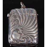 A silver vesta, of hinged rectangular form, with swirling decoration, stamped 925 Sterling, possibly
