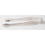 A pair of George III silver sugar tongs, having bright cut decoration, monogrammed RMB, 0.9oz, maker