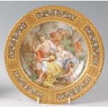 A late 19th century Vienna porcelain cabinet plate, the central ground decorated with a Bacchanalian