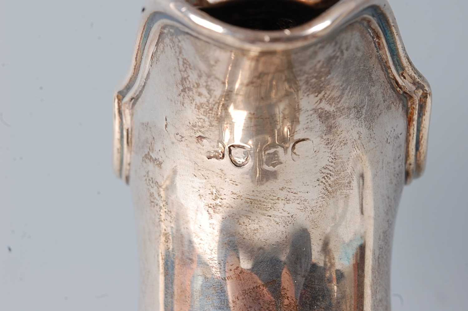 A Victorian silver claret jug, the lobed body with chased floral decoration, raised on a spreading - Image 3 of 5