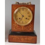 A Victorian rosewood and marquetry inlaid carriage clock, having an unsigned engraved brass dial