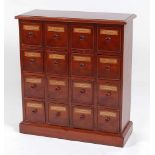A Victorian style mahogany apothecary's dispensary chest, fitted with four rows of four short