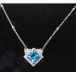 An 18ct white gold Boodle & Dunthorne blue topaz and diamond pendant, comprising a Princess cut blue