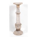 A Victorian carved alabaster torchere, the column with flutings and leaf carving, to an octagonal