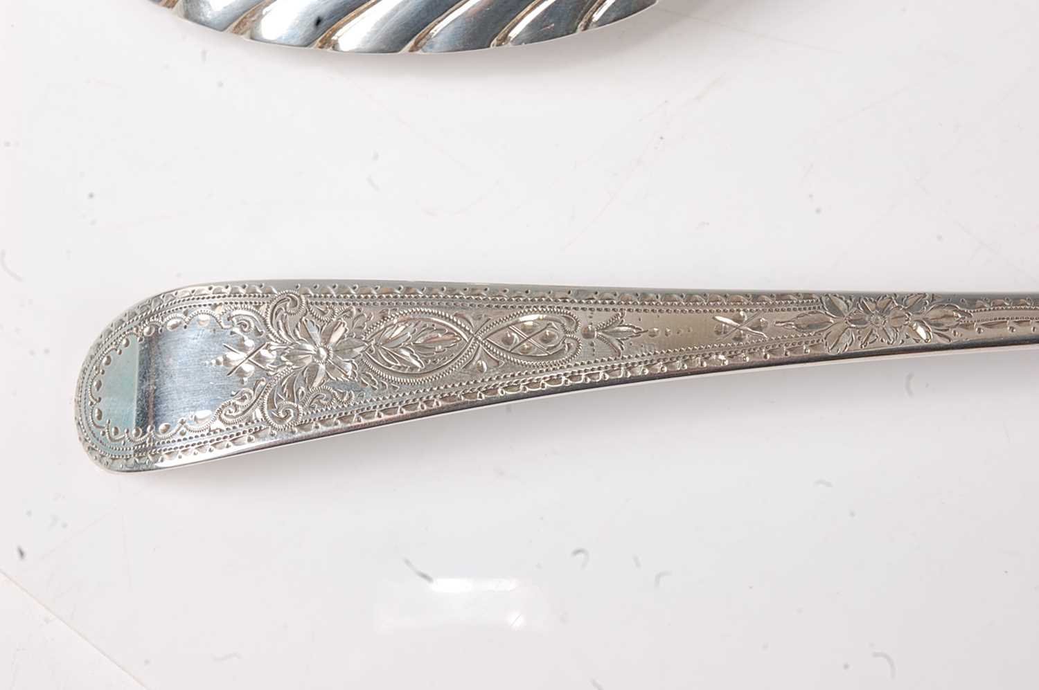 A pair of George III silver serving spoons, in the Old English pattern, each having bright cut - Image 4 of 4