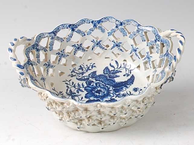 A Lowestoft porcelain chestnut basket, circa 1785, lattice-worked and blue and white printed in