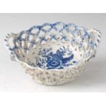 A Lowestoft porcelain chestnut basket, circa 1785, lattice-worked and blue and white printed in