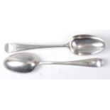 A pair of George III silver tablespoons, in the Old English pattern, each having feather banded