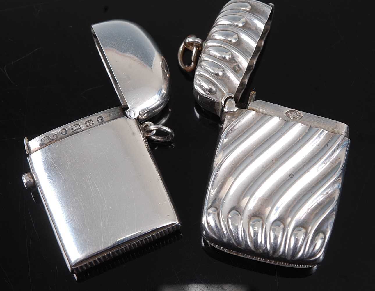 A late Victorian silver vesta, of plain undecorated hinged rectangular form, with domed cover and - Image 2 of 2