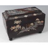 A Victorian papier-mâché and mother of pearl inlaid tea caddy, of sarcophagus form, containing two