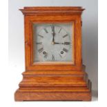 A late Victorian oak cased four-glass bracket clock, having unsigned silvered dial, twin winding