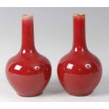 A pair of Chinese sang-de-beouf bottle vases, each being heavily potted, h.18cmCondition report: