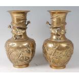 A pair of Chinese gilt bronze vases, the waisted necks each with entwined dragon, the bases with