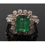 A white metal, tourmaline and diamond rectangular cluster ring, featuring a centre rectangular green