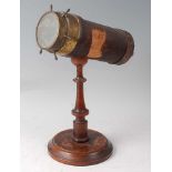 A late 19th century kaleidoscope on stand, being leather bound and lacquered brass, the cylinder