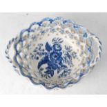 A Lowestoft porcelain chestnut basket, circa 1785, lattice worked and blue and white printed in