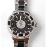 A lady's steel and black ceramic Tag Heuer Formula One quartz wristwatch, having a round black