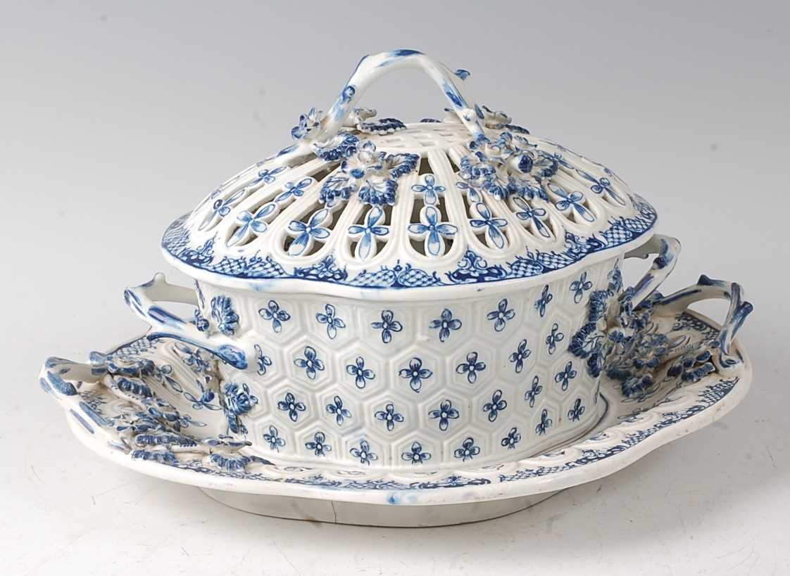 A Lowestoft porcelain chestnut basket and cover on stand, circa 1775-1885, underglaze blue decorated