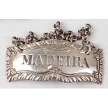 A George III silver decanter label for Madeira, with chain, maker Hester Bateman, no date letter