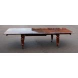 A Victorian mahogany extending dining table, of good size, the top having four extra leaves (one