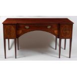 A Sheraton period mahogany and inlaid inverted breakfront sideboard, the top with satinwood