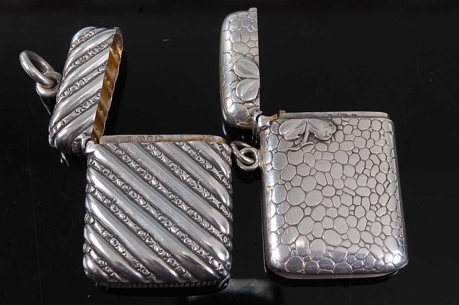 A late 19th century French silver vesta, of hinged rectangular form, surmounted by a four-leaf - Image 2 of 2