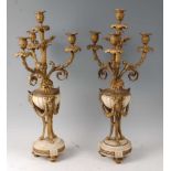 A large pair of late 19th century French gilt bronze and white marble candelabra, each with