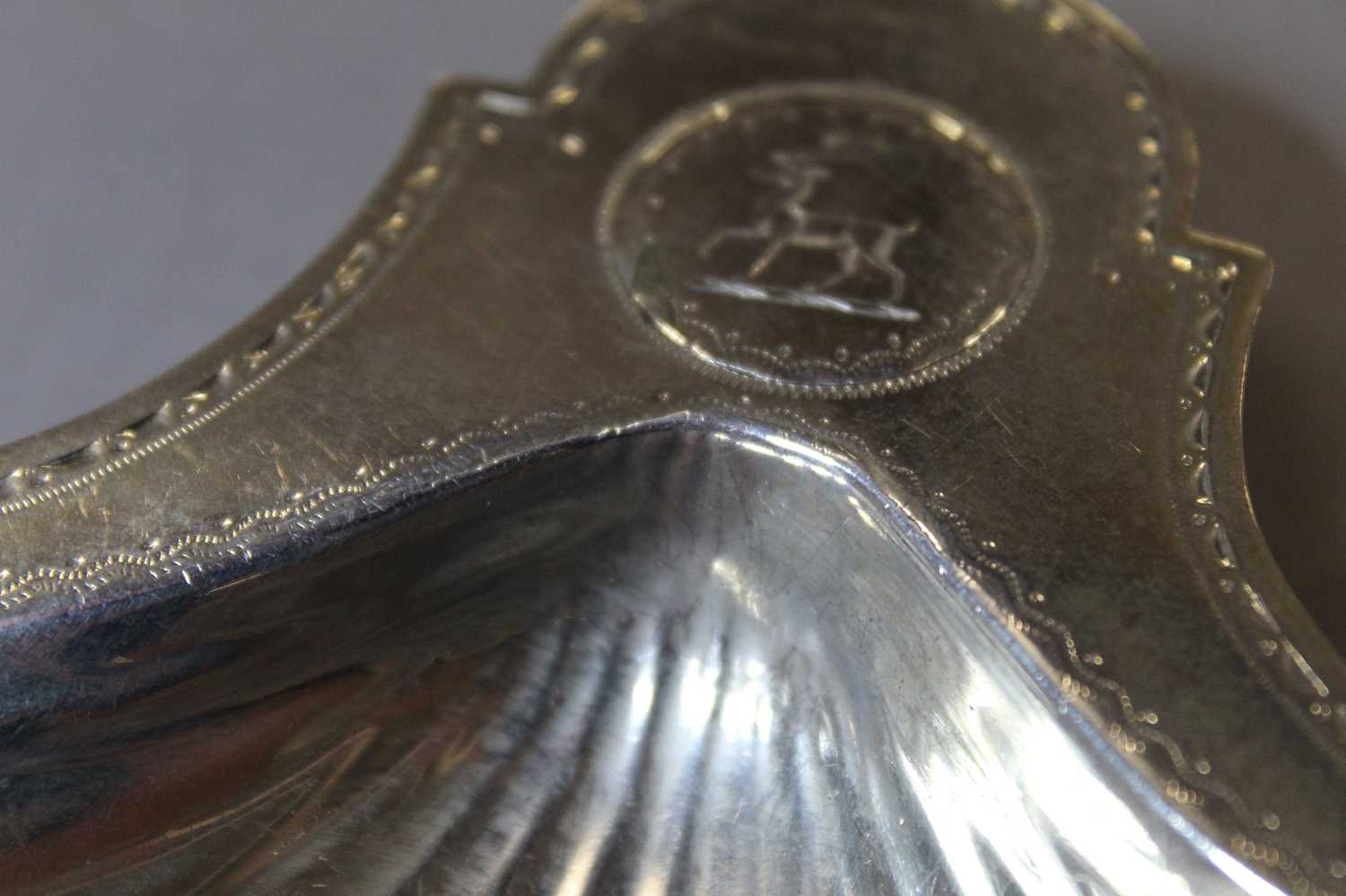 A set of three George III silver shell shaped butter dishes, each with bright cut engraving to the - Image 6 of 7