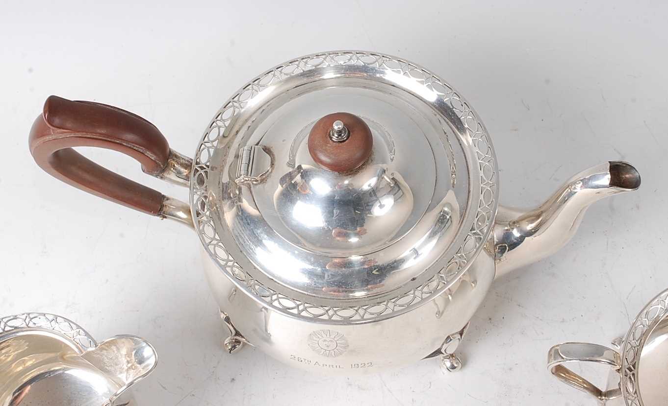 A George V silver three-piece tea set, comprising teapot, twin handled sugar and cream, each of - Image 2 of 4