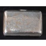 A Russian silver cigarette case, the hinged cover decorated with a cherub amidst a garland of
