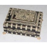 A circa 1900 Anglo-Indian tortoiseshell veneered and ivory mounted table box, the cover with central