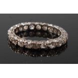 A white metal diamond full hoop eternity ring, with twenty-two Old European cut diamonds in