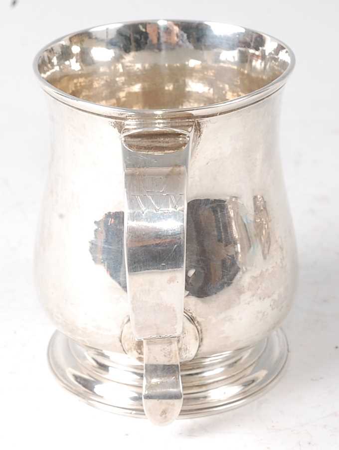 An early George II silver bell shaped small tankard, being later monogrammed, raised on an ogee - Image 2 of 4