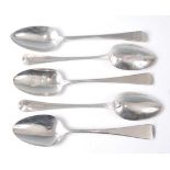 A harlequin set of nine George III and George IV silver tablespoons, each in the Old English pattern