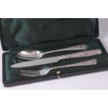 An Edwardian silver christening set, comprising dessert knife, fork and spoon, the handles each