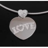 An 18ct white gold Chopard 'Love' pendant, featuring a 31x28mm heart shaped pendant with the word