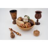 Items of treen including bowl and fruit, and two goblets etc