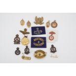 A quantity of military cap and other badges, medallions etc